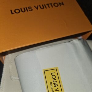 Louis Vuitton Multiple Wallet in Shadow leather.